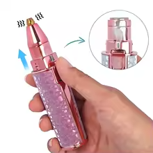 Battery-operated portable grooming tool with both attachment heads